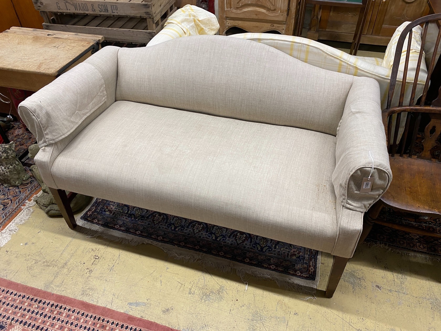 A pair of Victorian style upholstered settees with hump backs, scroll arms on square tapered legs, width 145cm, depth 74cm, height 84cm